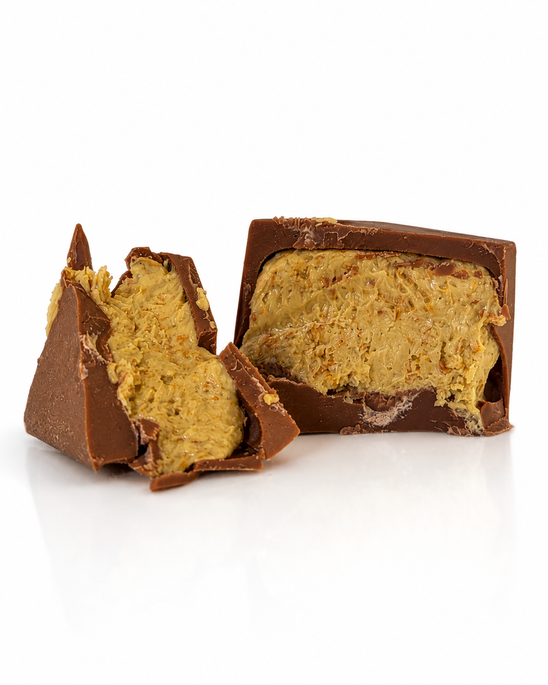 Dubai Truffle House pistachio truffle broken open, revealing kunafa and pistachio filling